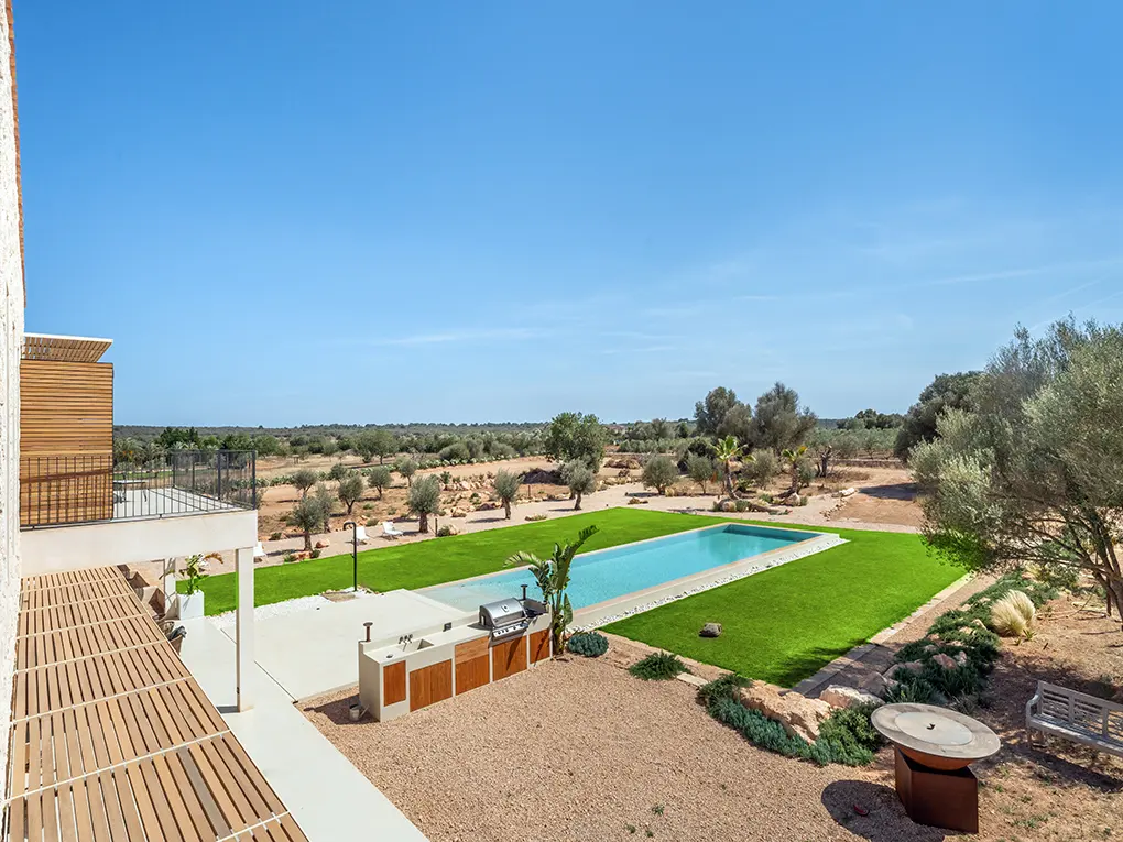 Roof terrace overlooking pool and landscape