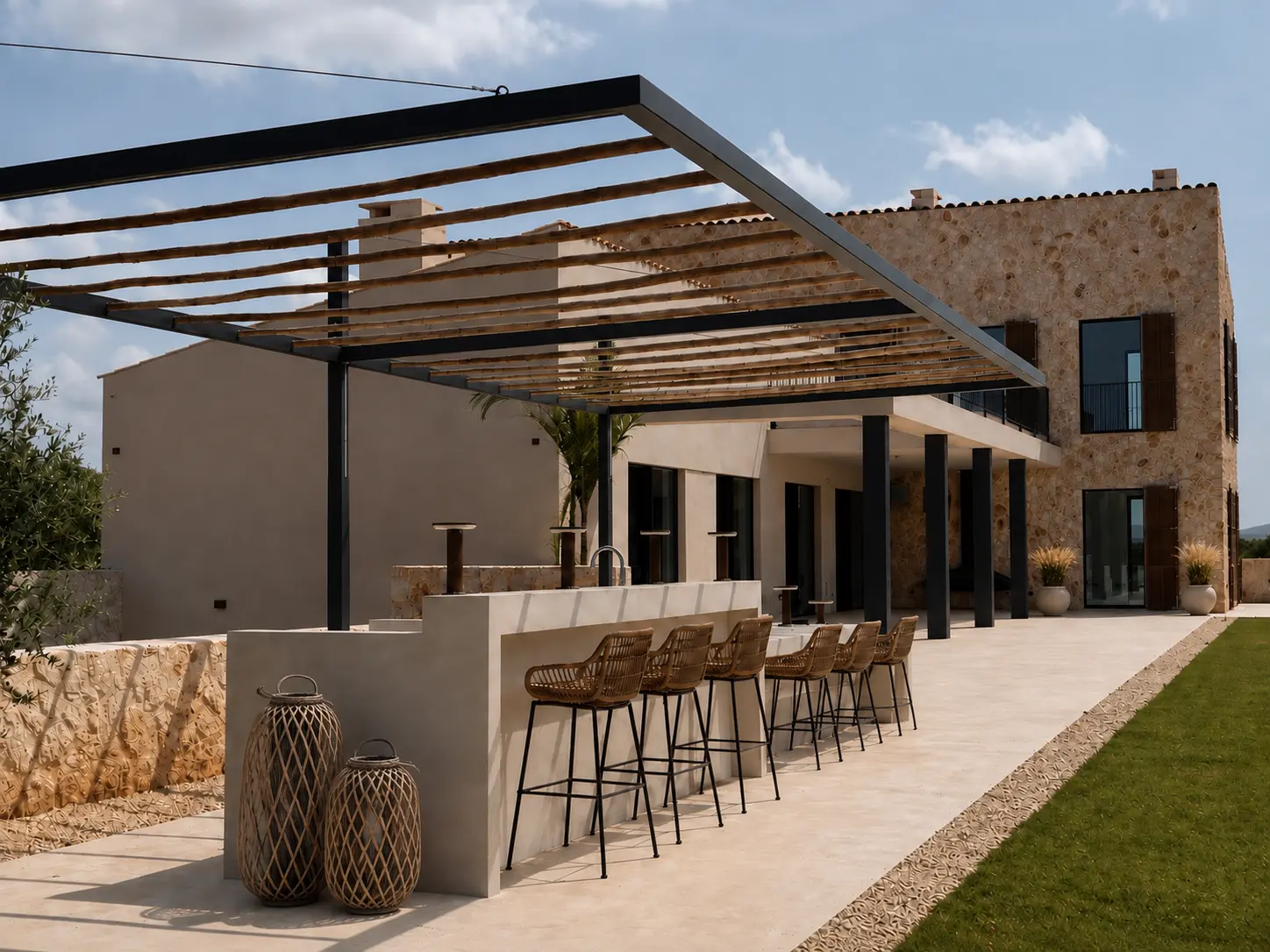 Outdoor kitchen with bar counter under the pergola