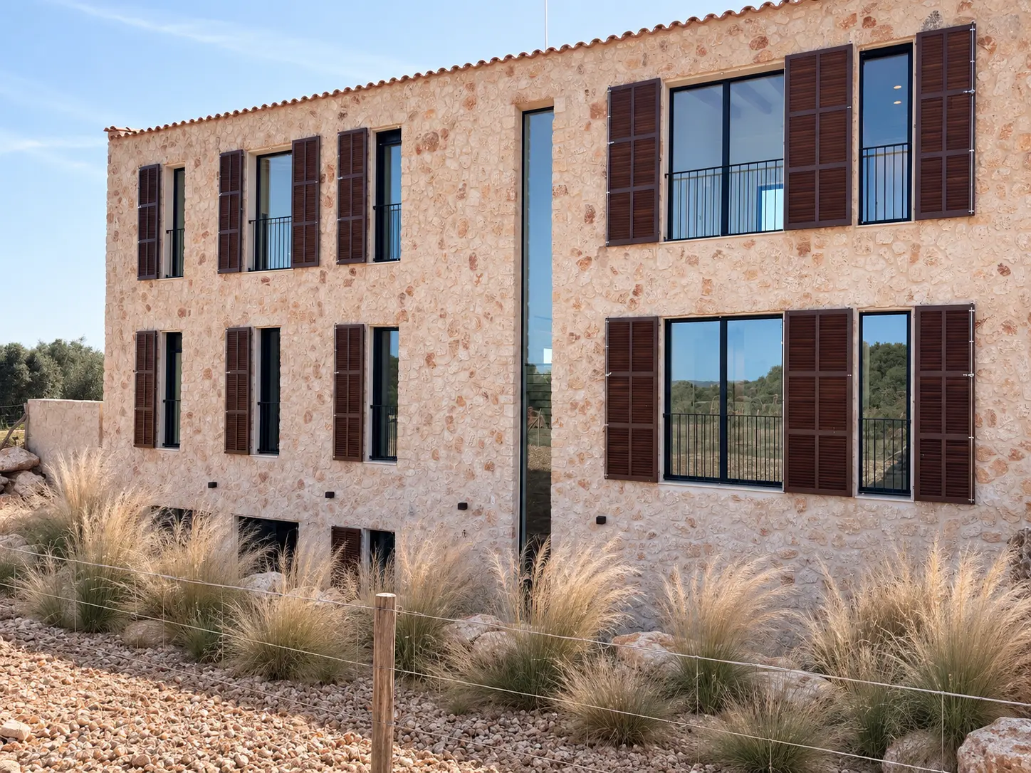 Natural stone facade with wooden shutters