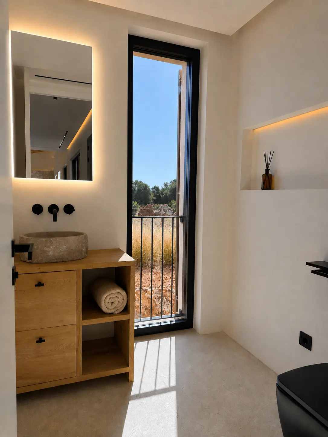 Guest bathroom with stone basin and daylight
