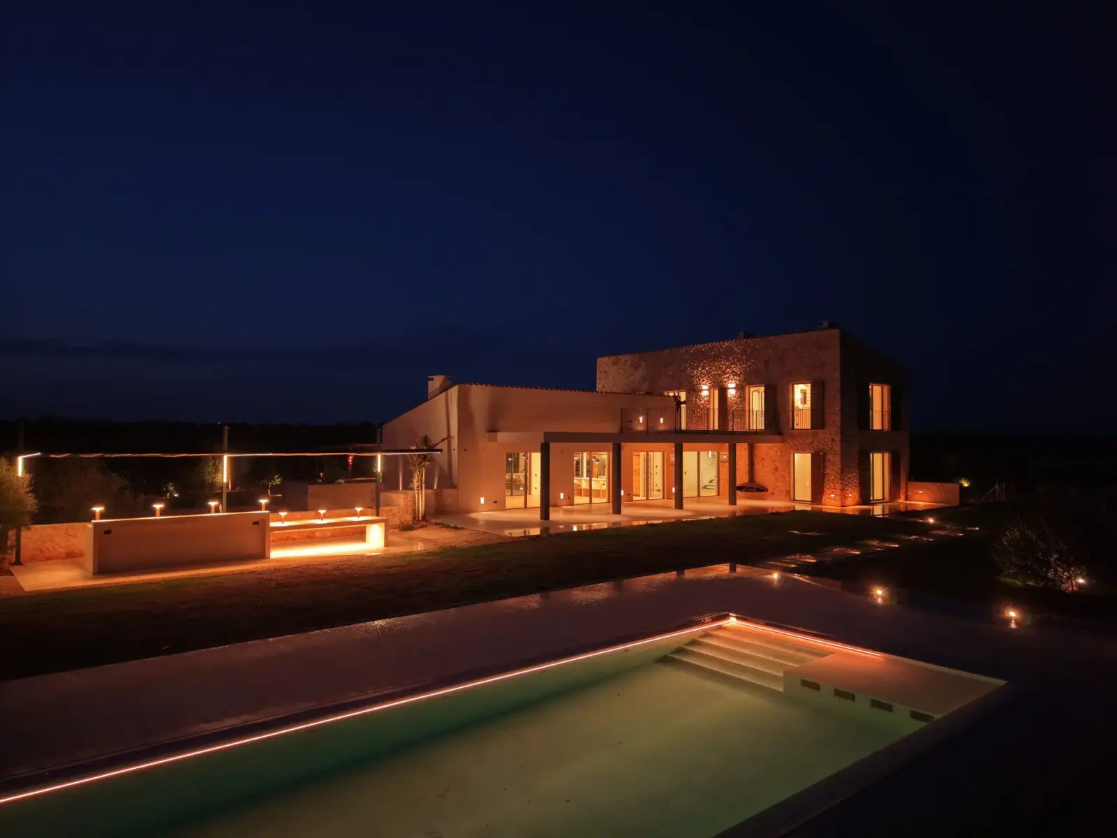 Son Catlar at blue hour — aerial view with pool