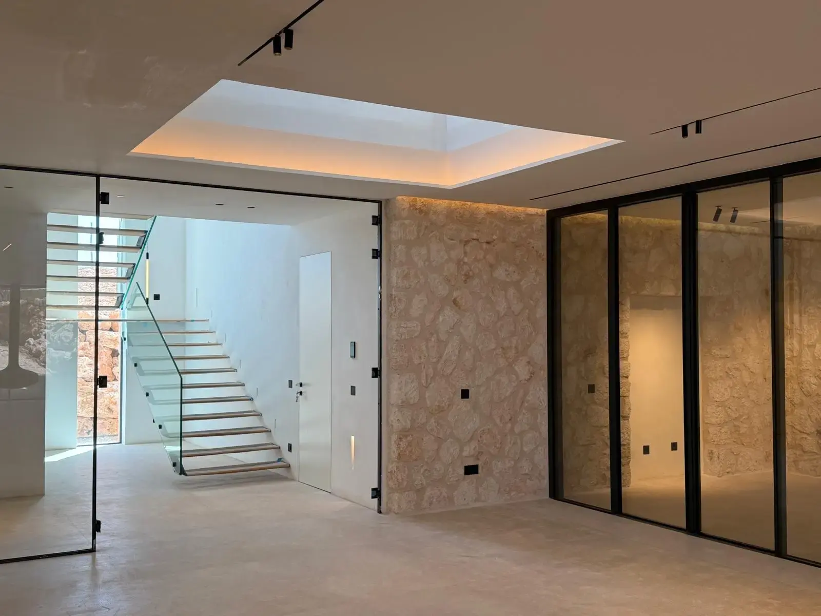 Glass staircase across three levels